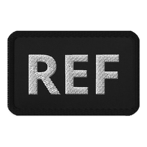 Può includere: Toppa ricamata nera con scritta bianca "REF".
