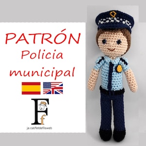 May include: Crochet pattern for a police officer doll. The doll is wearing a blue uniform with a black belt and a blue hat with a gold badge. The pattern is available in Spanish and English.