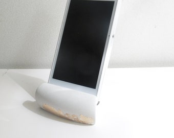 White concrete stand for mobile phone