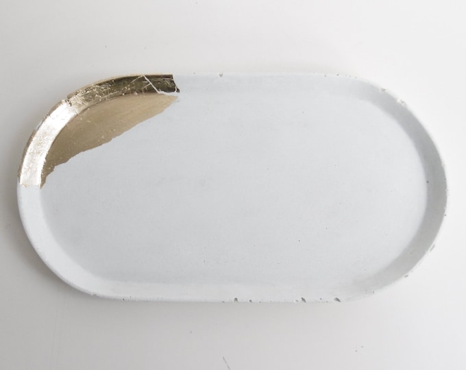 White concrete tray, dotted with gold