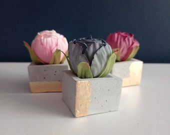 Trio of roses on a concrete base