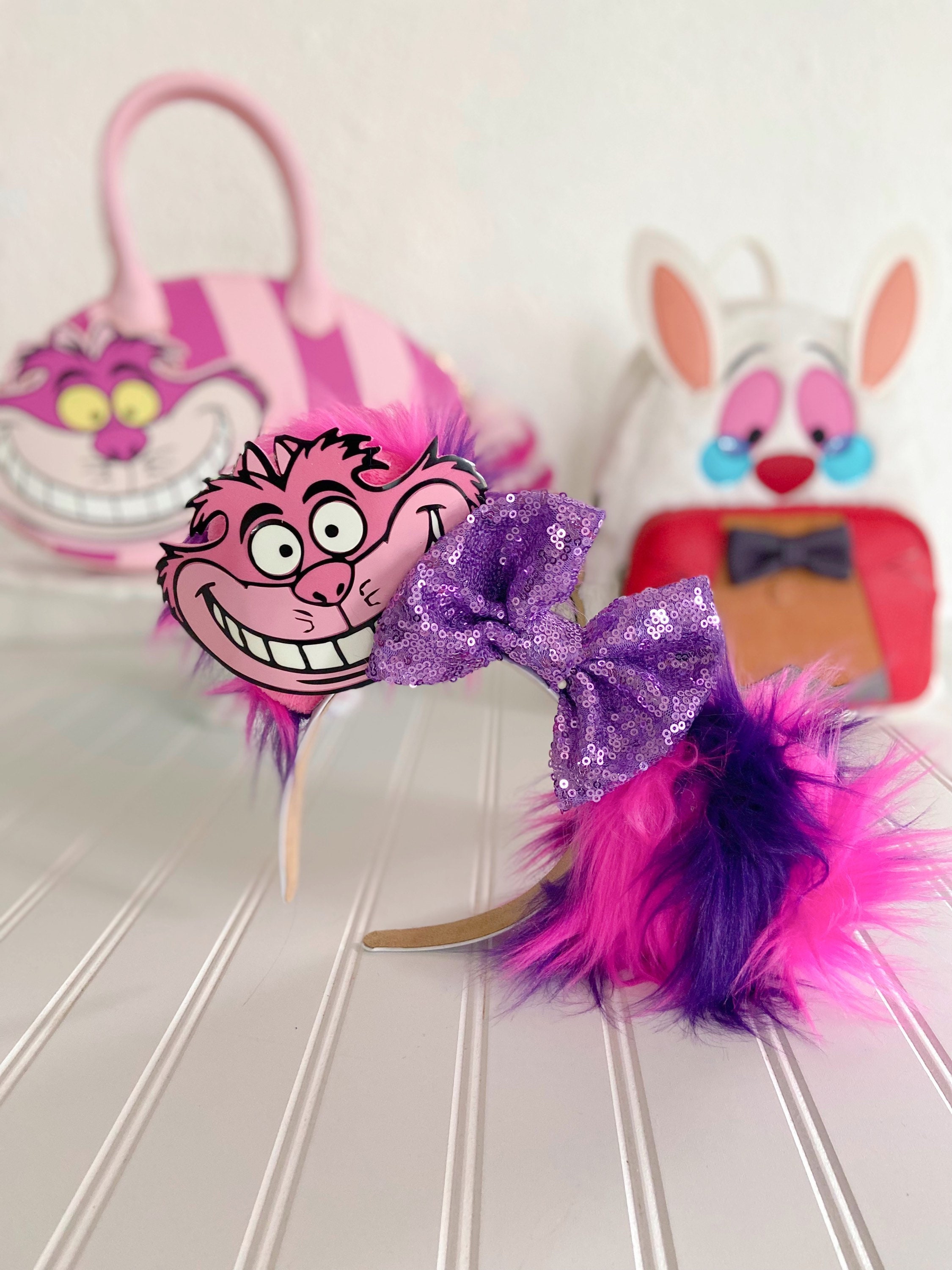 Disney Pink Cheshire Cat Ear Headband with Sequin Bow Smiling Cheshire Cat Ear Headband Available at Disney World  main image 2
