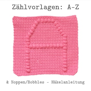 以下が含まれることがあります： ピンクのクロシェの正方形で、ボブルで作った立体的な文字Aがあります。正方形には「Zählvorlagen: A-Z & Noppen/Bobbles - Häkelanleitung」とラベルが貼られています。