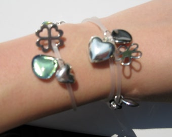 Transparent, triple bracelet with pendants