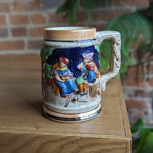 vintage stein | woman and man sitting in the trees wood handles | antique decorative collectable mug