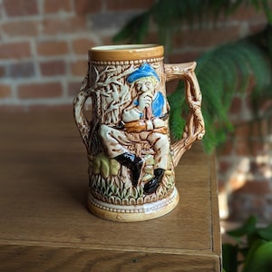 vintage stein | tall sitting man with pup two wood handles | antique decorative collectable mug