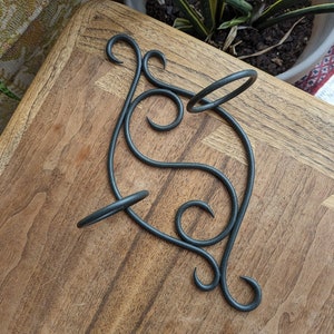 dark metal swirling wall-hung double candle holder | vintage retro rustic bohemian gothic