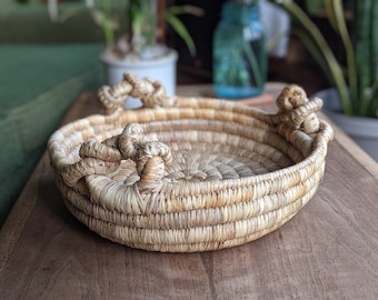 round wicker jute basket with three knotted handles | eclectic bohemian rustic coffeetable centerpiece
