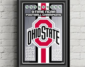 May include: Framed poster with a black border. The poster features the words "9-TIME NCAA FOOTBALL CHAMPIONS" above the Ohio State logo in red and white. Below the logo are the years 1942, 1954, 1957, 1961, 1968, 1970, 2002, 2014, and 2024.
