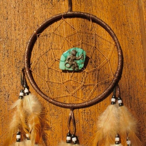 Turquoise dromenvanger met hoepeldanser