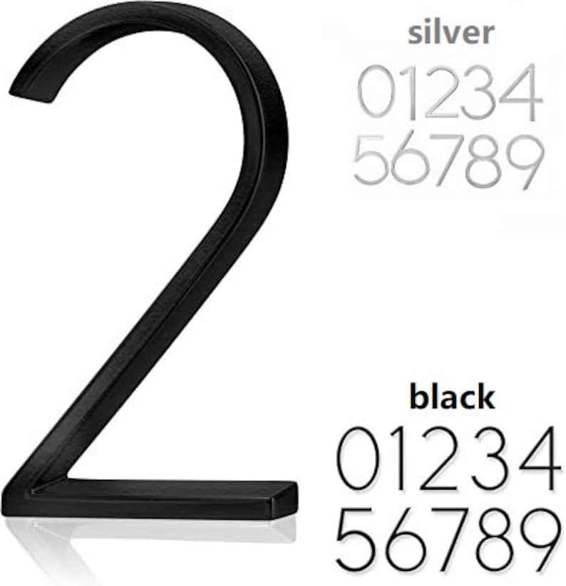May include: A black metal number 2, with a modern font, is displayed prominently. The image also shows a set of silver and black numbers 0-9, in a similar font. The word "silver" and "black" are above the numbers.
