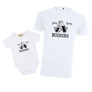 May include: White baby onesie and t-shirt with black text and images. The onesie says "Jonas Franz Buddies" with a baby bottle and beer bottle clinking. The t-shirt says "Jonas Franz Buddies" with a baby bottle and beer bottle clinking.