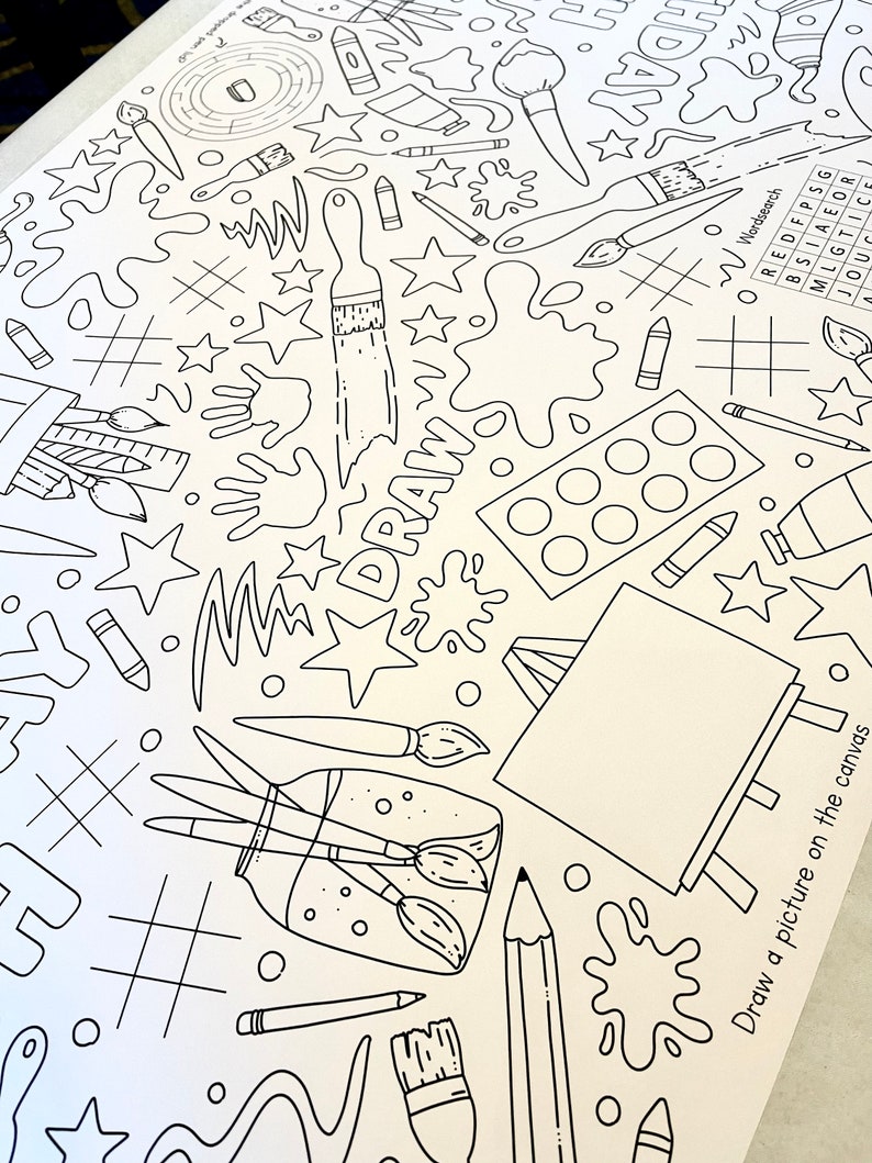May include: A black and white coloring page featuring a variety of art supplies, including paintbrushes, paint palettes, pencils, and a canvas. The page also includes the word "DRAW" written in large letters. The text "Draw a picture on the canvas" is at the bottom of the page.