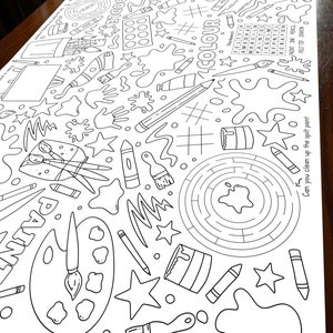 May include: Black and white coloring page featuring a birthday party theme with paintbrushes, paint cans, stars, and a maze. The text "Happy Birthday Ellie" is written at the top of the page.