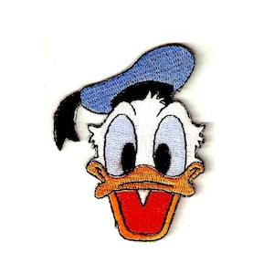 May include: A cartoon embroidered patch of Donald Duck with a blue sailor hat and a white face. His beak is orange and his eyes are black with white pupils.