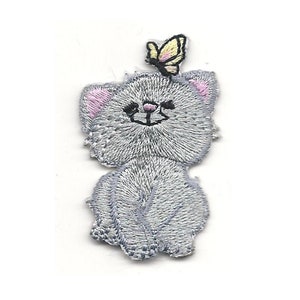 May include: A gray embroidered iron-on patch of a cartoon cat with a yellow butterfly on its head.
