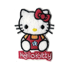 May include: Embroidered iron-on patch featuring Hello Kitty in a red dress with a flower design. The patch has a red banner with the text "Hello Kitty" in white.