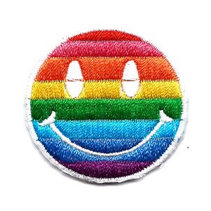 May include: Rainbow smiley face embroidered patch. The patch is circular and features a rainbow design with a white outline.