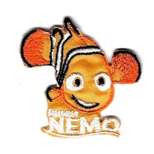 May include: Orange and white embroidered patch of a cartoon clownfish with the text "Finding Nemo" underneath.