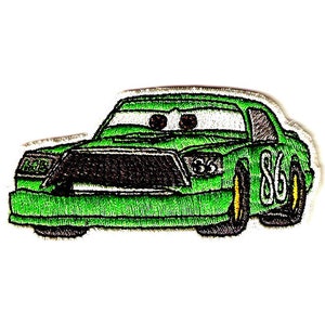 May include: Green cartoon race car with the number 86 on the side. The car has a black grill and headlights. The car has a cartoon face with big eyes.