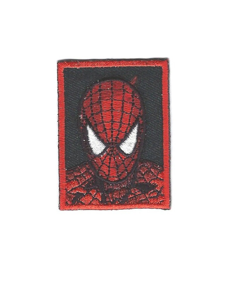 May include: Red and black embroidered iron-on patch featuring a close-up of Spider-Man's face.
