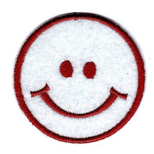 May include: Red embroidered smiley face patch with a white background.