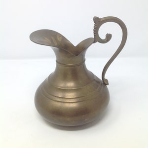 Vintage ornate PWF brass pitcher