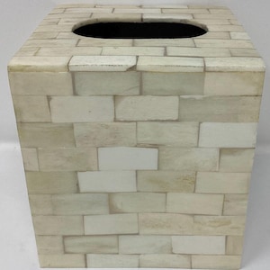 May include: White bone inlay tissue box cover with a brick pattern.