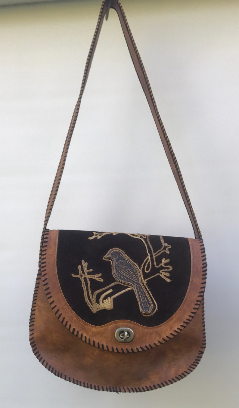 Vintage hand tooled leather bag with bird design