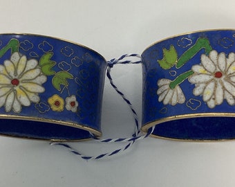 Vintage pair of Cloisonne blue napkin rings with white flowers