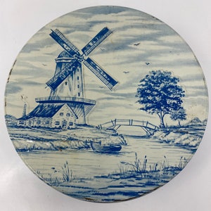 Vintage blue and white tin with windmill and boat