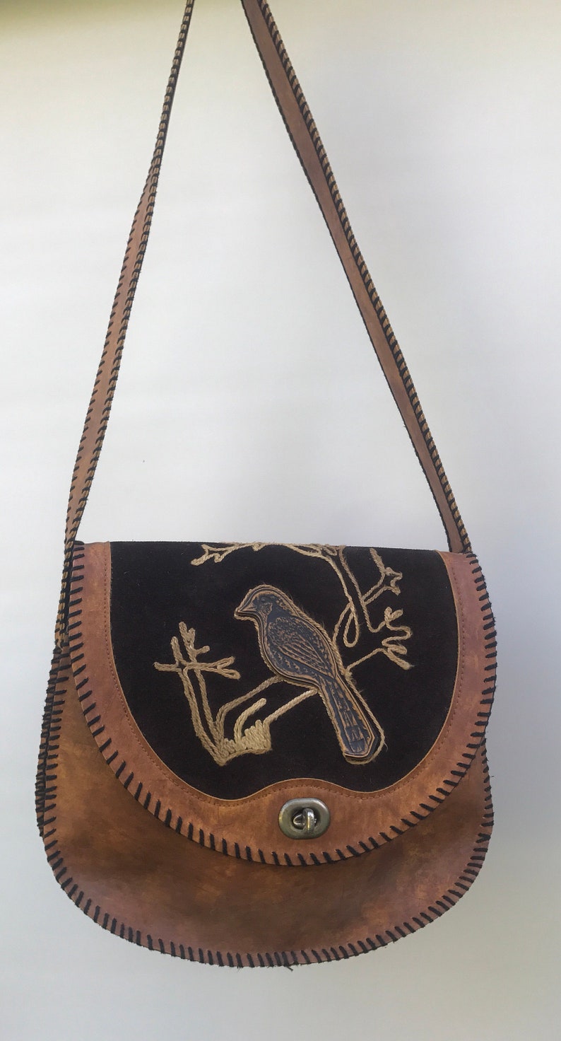 Vintage hand tooled leather bag with bird design