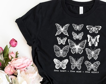 May include: Black t-shirt with a white graphic of butterflies and the text "Free heart - Free mind - Free spirit".