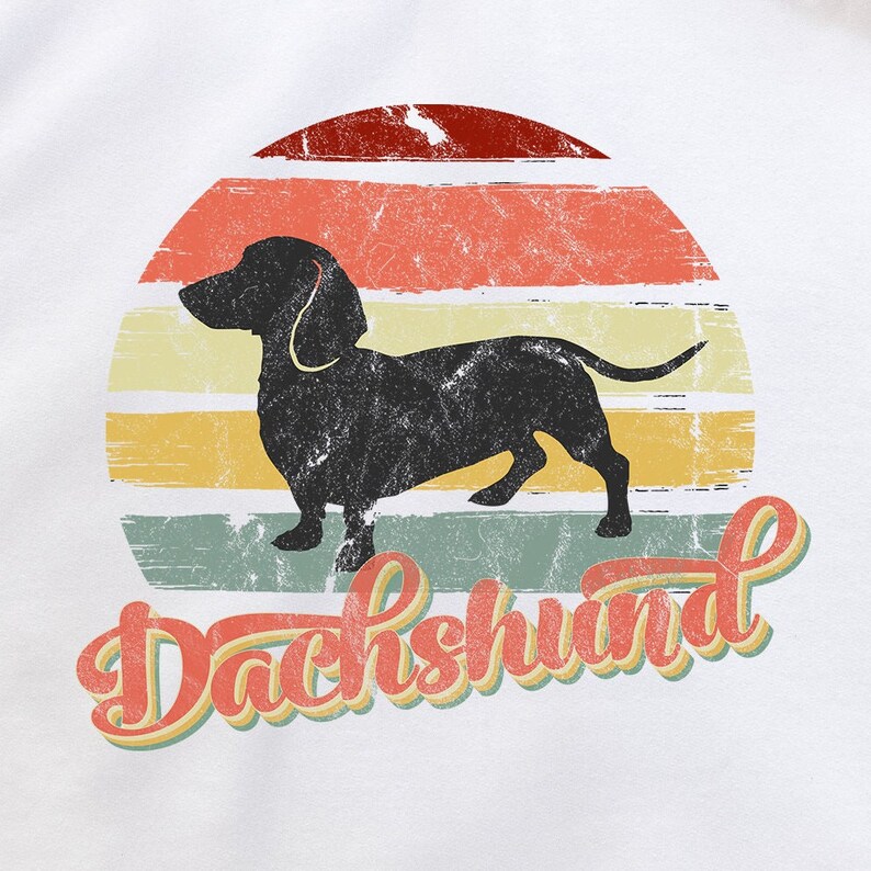 May include: A black silhouette of a dachshund dog standing in front of a retro-style sunset with the word "Dachshund" written in a vintage font.
