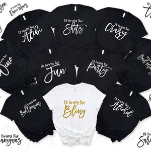 May include: A set of 14 black t-shirts with white text, each shirt has a different phrase, such as "I'll bring the booze", "I'll bring the wine", "I'll bring the fun", and "I'll bring the party". One white t-shirt with gold text says "I'll bring the bling".