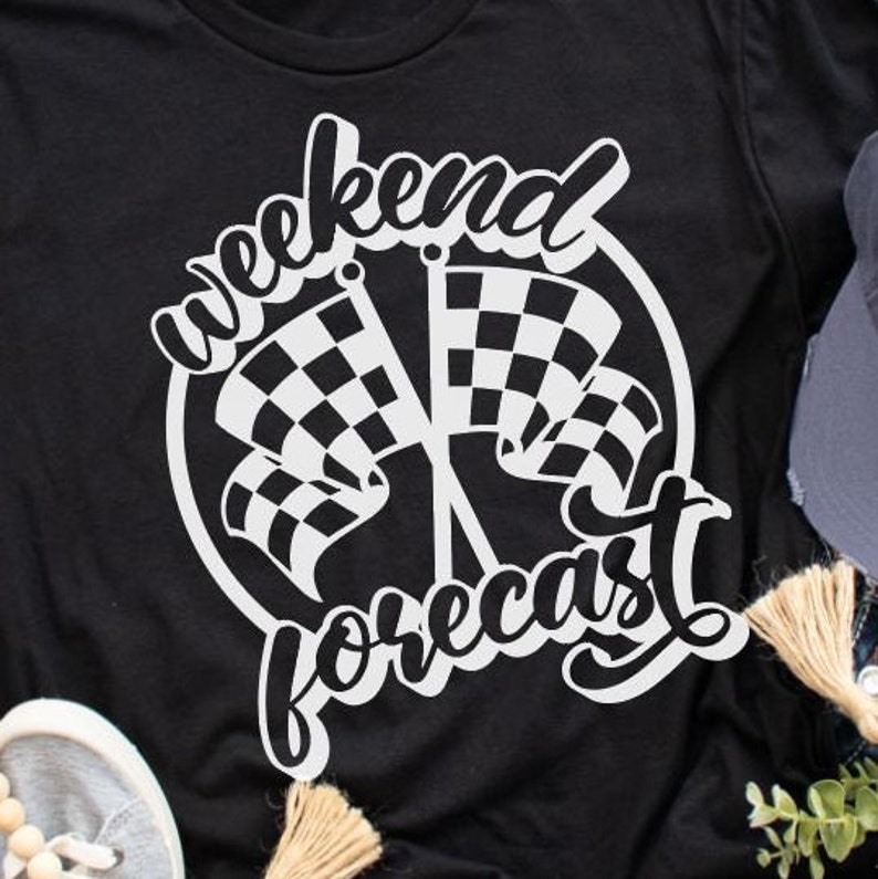 May include: Black t-shirt with a white graphic design of chequered flags and the text "Weekend Forecast".