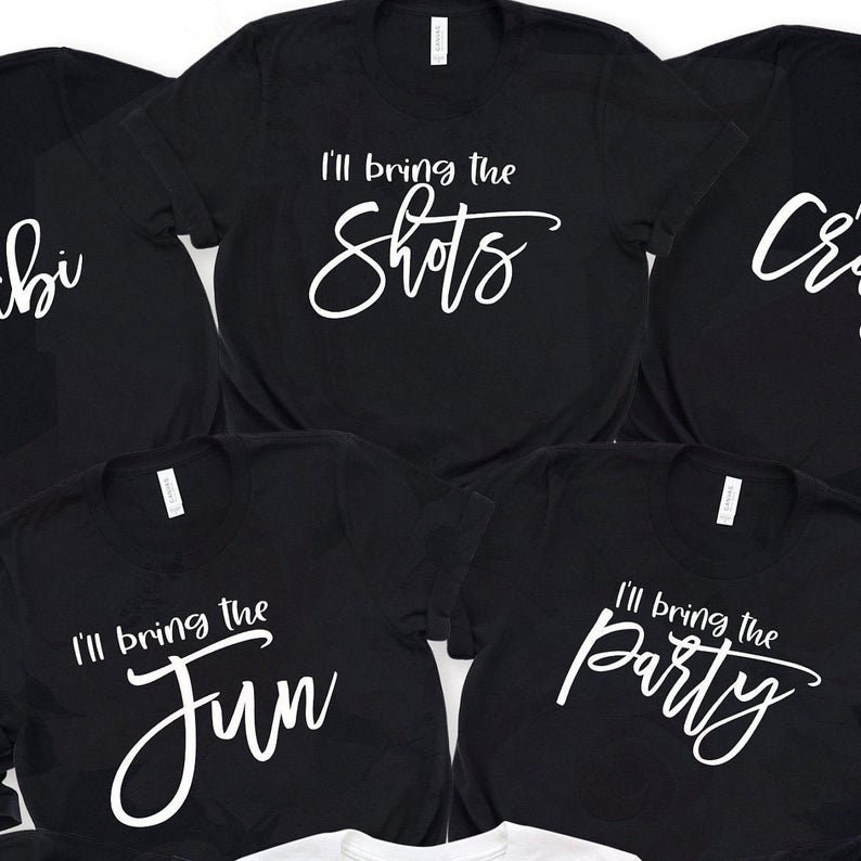 May include: Five black t-shirts with white text. The shirts say "I'll bring the shots", "I'll bring the fun", "I'll bring the party", "Crib", and "bi".
