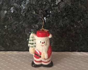 Santa Holding a Christmas Tree Ornament