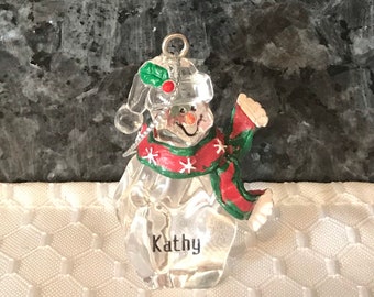 Women's Snowman Plastic Ornament with the name "Kathy"