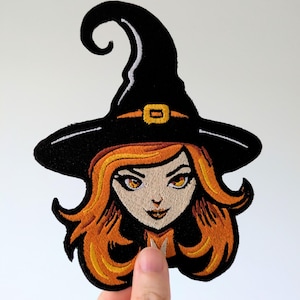 May include: A white ceramic mug with a black handle and the text "But First, Coffee" in a bold, black font. The mug is set against a blurred background, suggesting a cozy setting. The mug appears to be approximately 4 inches tall.