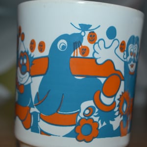 Vintage  Becher 70er Jahre  1 von 3 orange türkis Zirkus Clown Seehund seventies mug circus