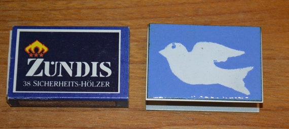 平和の鳩のデザインが施されたヴィンテージマッチ箱、金属製マッチ箱