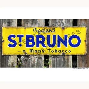 May include: A vintage yellow metal sign with the text "Ogden's ST. BRUNO - a Man's Tobacco" in blue lettering. The sign is mounted on a weathered wooden fence, showing signs of age and wear.
