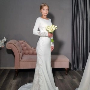 Minimalist modest  elegant closed  embroidery wedding dress with long sleeves and boat neckline