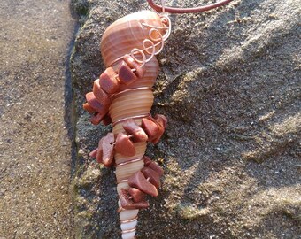 Spiral cone seashell wire wrapped with goldstone chips. Goldstone seashell. Wire wrapped seashell seashell crystal. Crystal and seashell