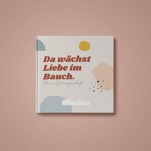 Könnte beinhalten: Ein weißer Buchumschlag mit dem Text "Da wächst Liebe im Bauch. Meine Schwangerschaft" in brauner Schrift mit abstrakten Formen in Blau, Gelb und Rosa.