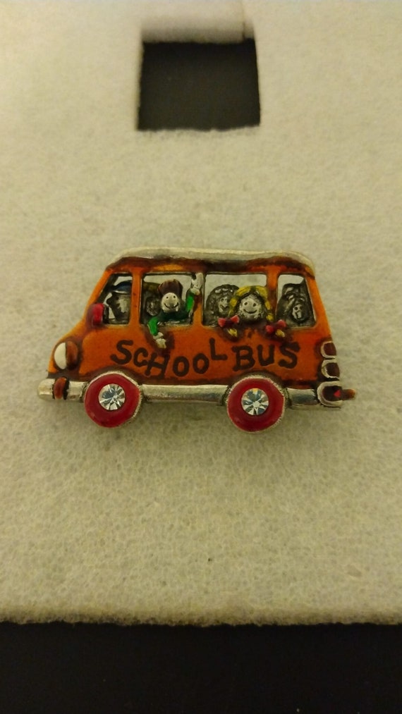 AJMC school bus brooch