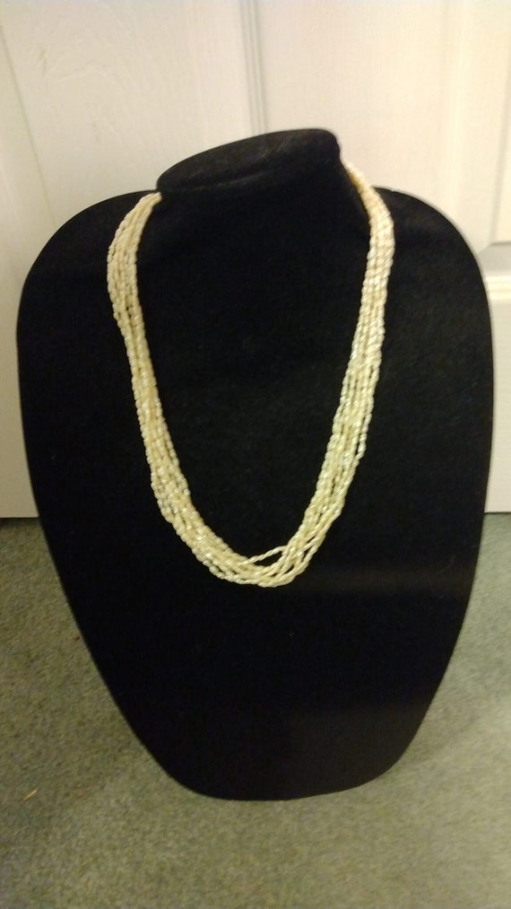 Multi-strand genuine seed pearl necklace with ster