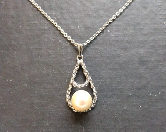 Genuine pearl pendant on sterling silver chain
