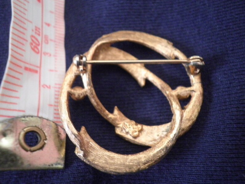 Hedy gold tone brooch